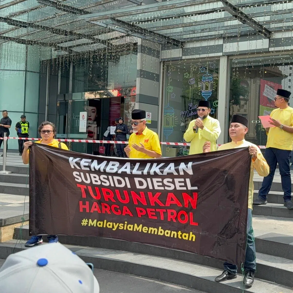 Protesters with a banner calling for diesel subsidies and cheaper petrol prices in Kuala Lumpur on April 5.
