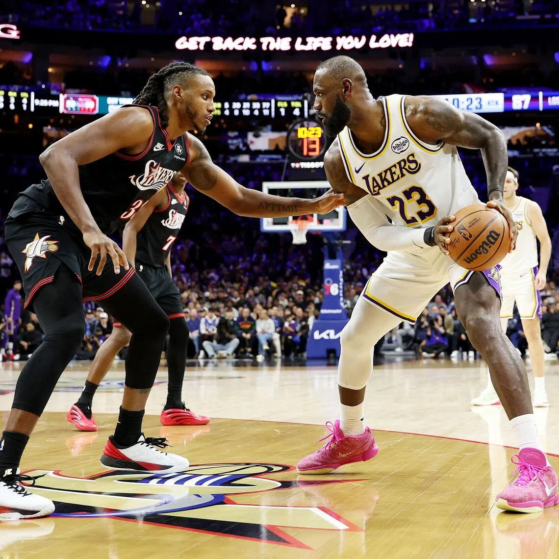 Lebron James of the Los Angeles Lakers drives against Jabari Walker of the Philadelphia 76ers during the second half at Xfinity Mobile Arena.