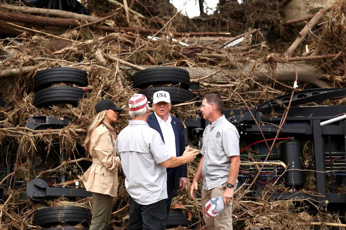 US President Donald Trump and first lady Melania Trump speaking to first responders, as they visit Kerr County, Texas, on July 11.
