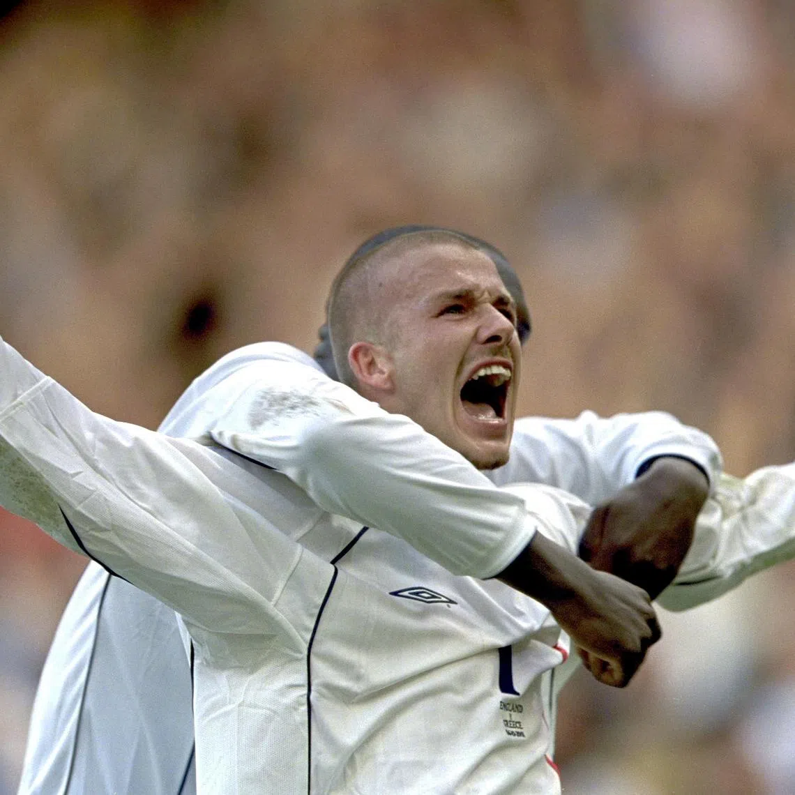 Footballers like David Beckham (above), Steven Gerrad and Wayne Rooney were part of a Golden Generation of English footballers that inspired the writer's support for England.