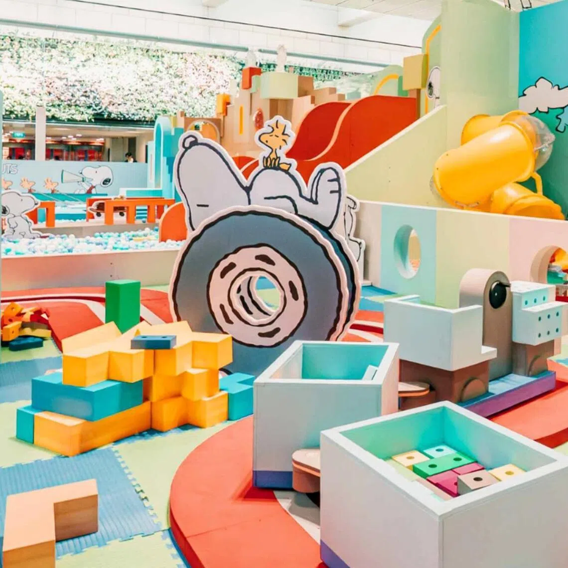 Kids can burn off energy at Peanuts Summer Sports Park and take fun photos in the "locker room".