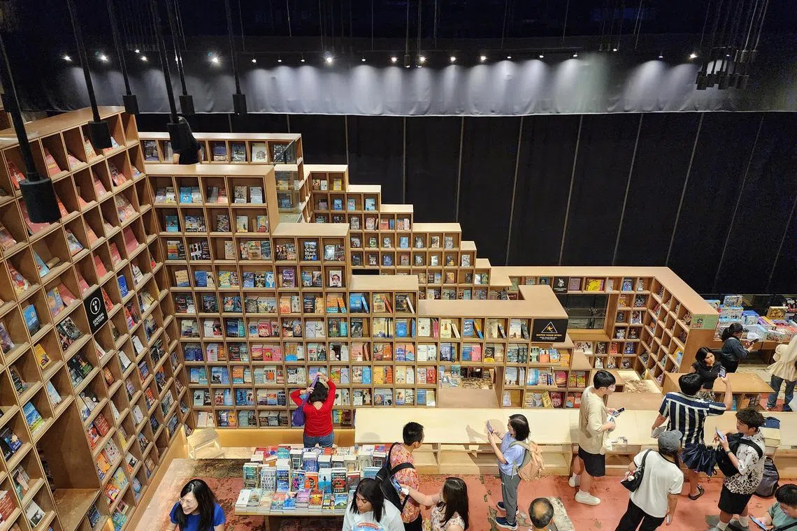 hzbooks - The BookXcess store at RexKL sees hordes of visitors flocking to take selfies here for its unconventional aesthetics.
ST PHOTO: HAZLIN HASSAN