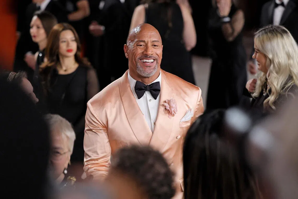 HOLLYWOOD, CALIFORNIA - MARCH 12: Dwayne Johnson attends the 95th Annual Academy Awards on March 12, 2023 in Hollywood, California.   Neilson Barnard/Getty Images/AFP (Photo by Neilson Barnard / GETTY IMAGES NORTH AMERICA / Getty Images via AFP)
