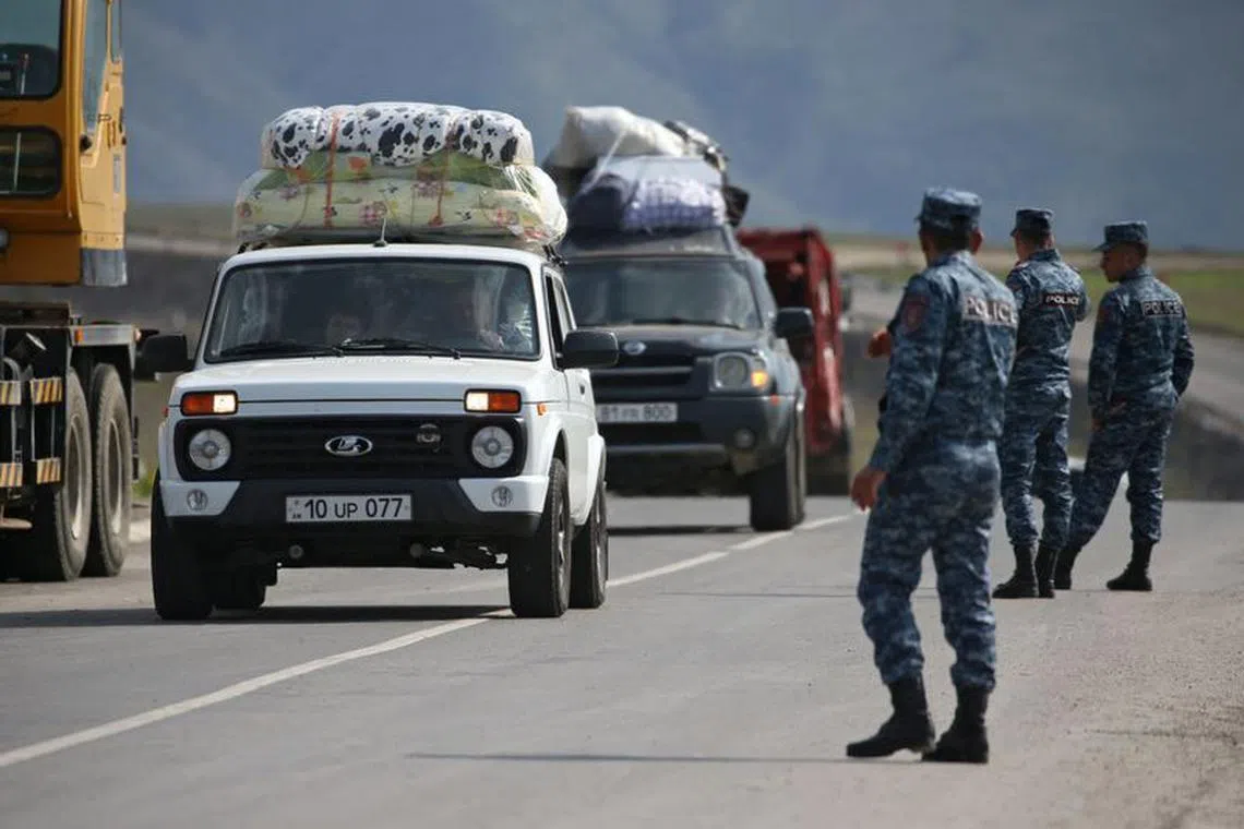 Refugees from Nagorno-Karabakh region arrive in the border village of Kornidzor, Armenia, September 29, 2023. REUTERS/Irakli Gedenidze