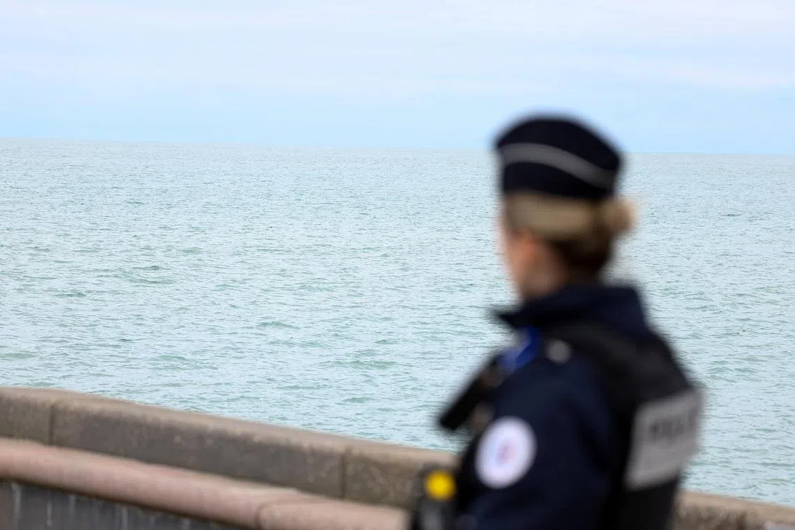 A police member looks on in Wimereux, near Calais, after migrants died in an attempt to cross the English Channel, in France, April 23, 2024. REUTERS/Yves Herman/File Photo