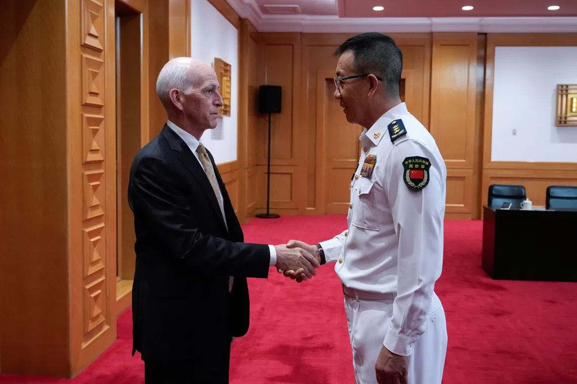 U.S. Rep. Adam Smith (D-WA) shakes hands with Chinese Defense Minister Dong Jun as he leads a bipartisan group of U.S. lawmakers for a meeting at the Chinese Ministry of Defense in Beijing, China, September 22, 2025. Mahesh Kumar A./Pool via REUTERS
