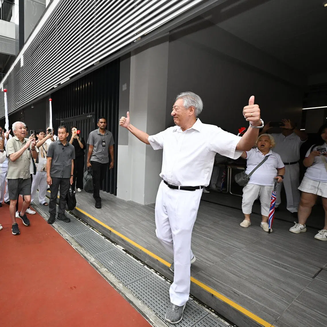 Senior Minister Teo Chee Hean greeting PAP supporters at the Yusof Ishak Secondary School nomination centre on April 23.
