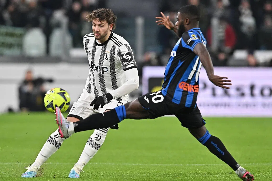 Juventus' Manuel Locatelli (L) and Atalanta's Jeremie Boga in action during their Italian Serie A match