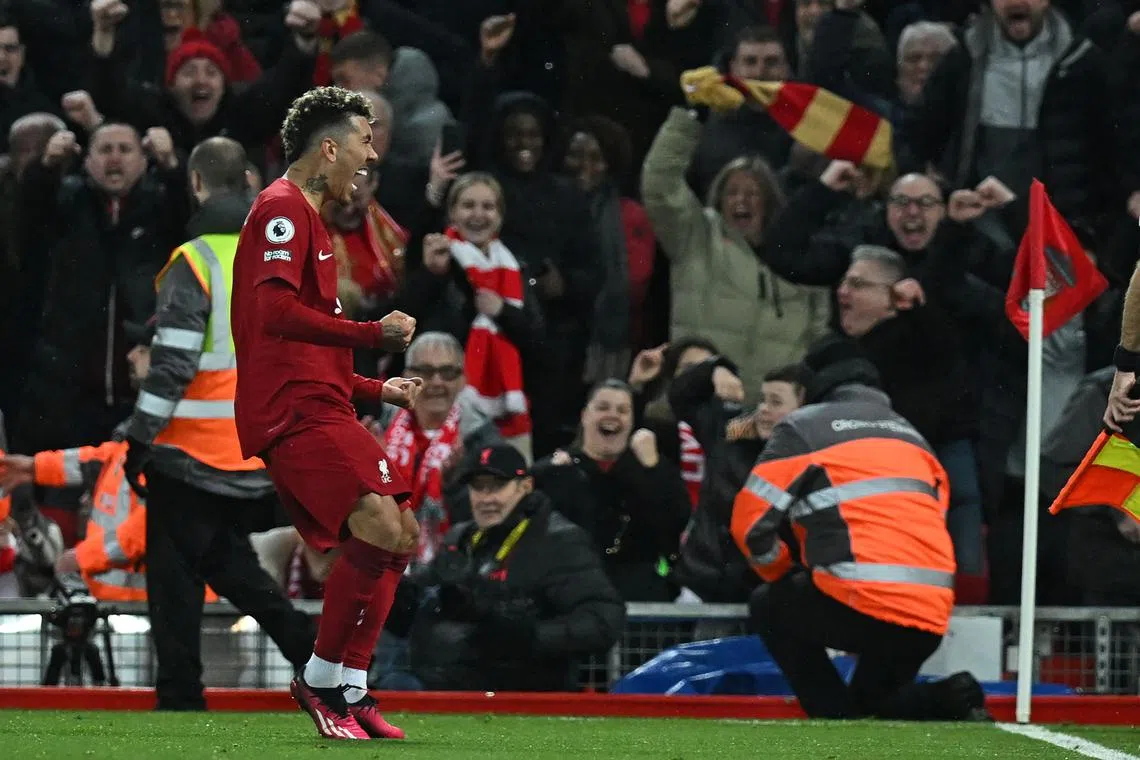 Liverpool's Brazilian striker Roberto Firmino celebrates after scoring their seventh goal.