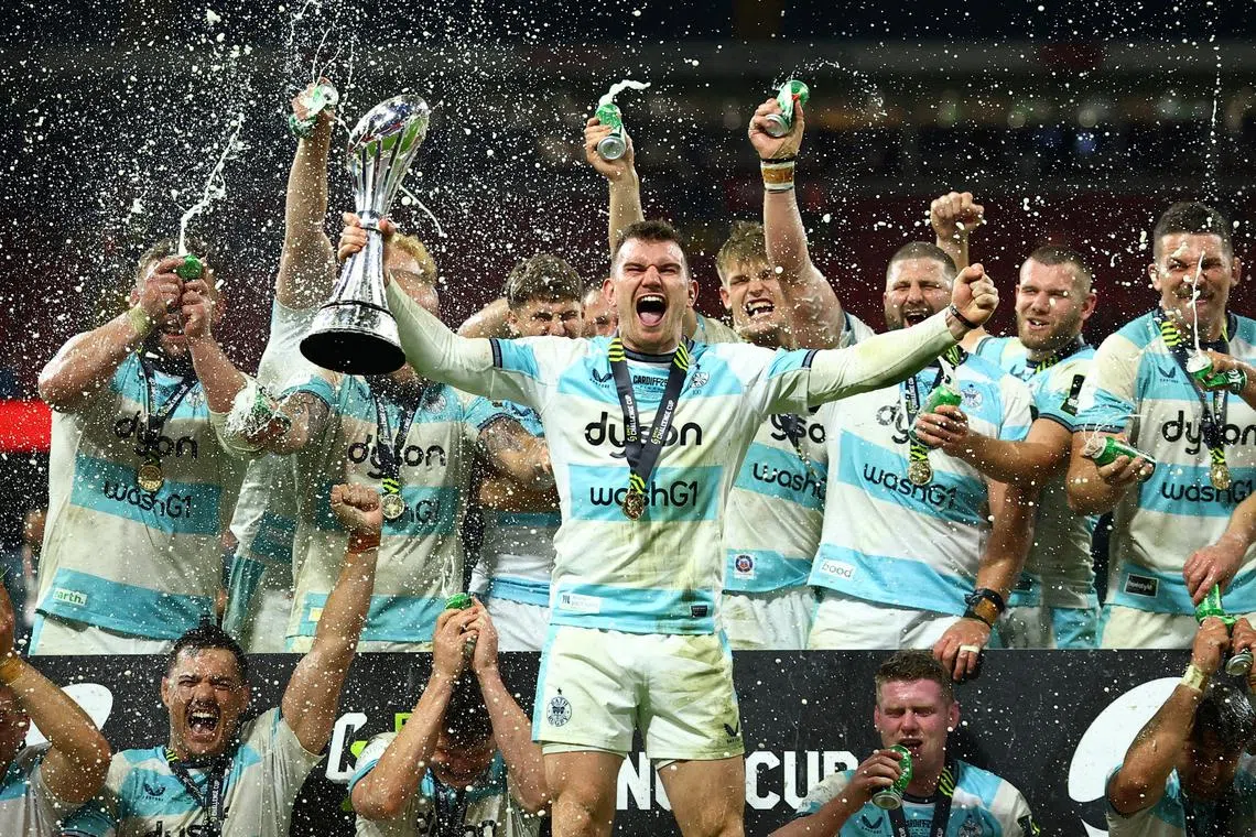 FILE PHOTO: Rugby Union - European Challenge Cup Final - Bath Rugby v Lyon - Principality Stadium, Cardiff, Wales, Britain - May 23, 2025 Bath Rugby's Ben Spencer lifts the trophy as he celebrates winning European Challenge Cup with teammates Action Images via Reuters/Andrew Boyers/File Photo