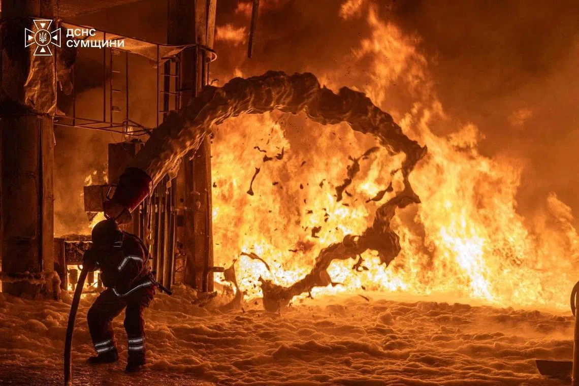 A firefighter works at the site of a petrol station hit by a Russian drone strike, amid Russia's attack on Ukraine, in Sumy, Ukraine, in this handout picture released July 23, 2026. Press service of the State Emergency Service of Ukraine/Handout via REUTERS ATTENTION EDITORS - THIS IMAGE HAS BEEN SUPPLIED BY A THIRD PARTY. DO NOT OBSCURE LOGO. TPX IMAGES OF THE DAY