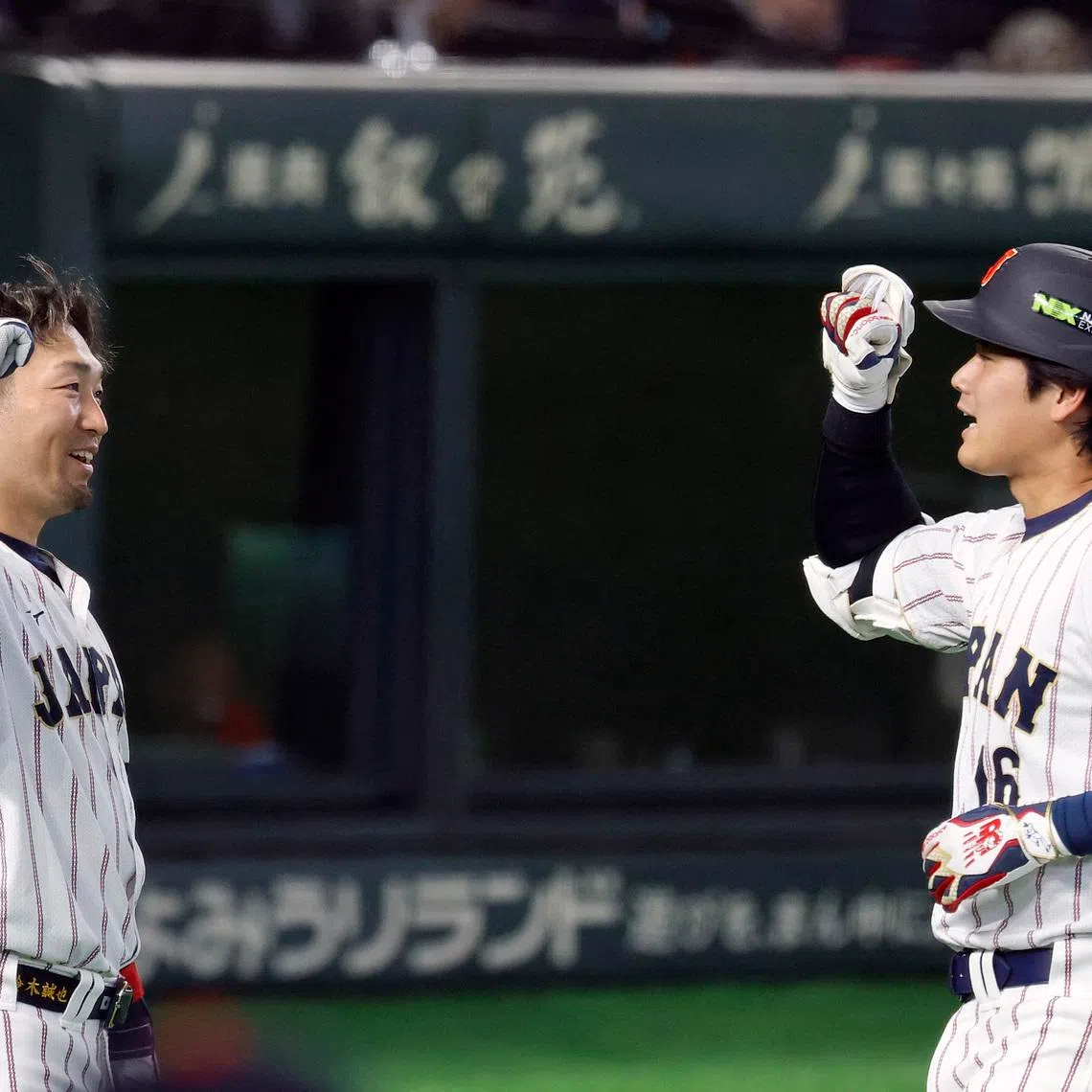 Baseball - World Baseball Classic - Pool C - South Korea v Japan - Tokyo Dome, Tokyo, Japan - March 7, 2026 Japan's Shohei Ohtani and Seiya Suzuki react REUTERS/Kim Kyung-Hoon