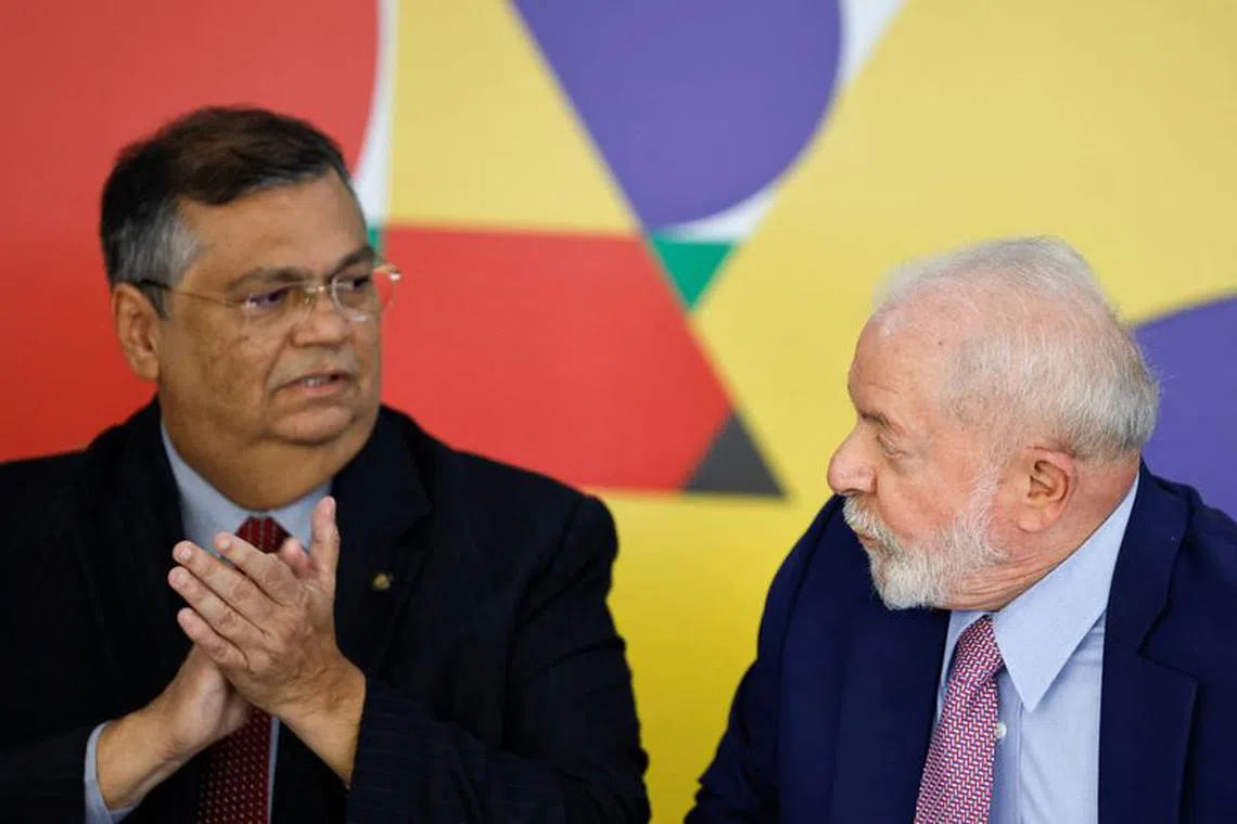 Brazil's president Luiz Inacio Lula da Silva and Brazil's Minister of Justice Flavio Dino look at each other during a press conference at the Planalto Palace in Brasilia, Brazil, November 1, 2023. REUTERS/Adriano Machado/File Photo