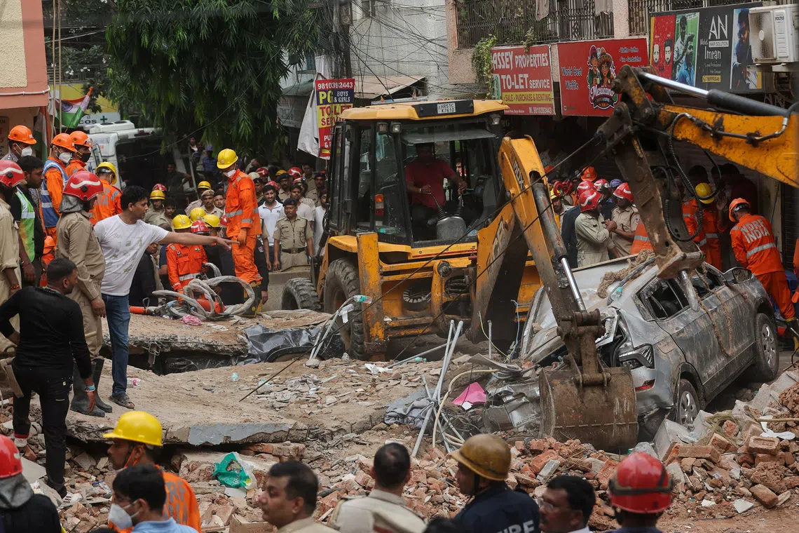 Emergency personnel inspect the site and look for survivors after a building collapsed, in New Delhi, India, September 6, 2026. REUTERS/Francis Mascarenhas     TPX IMAGES OF THE DAY