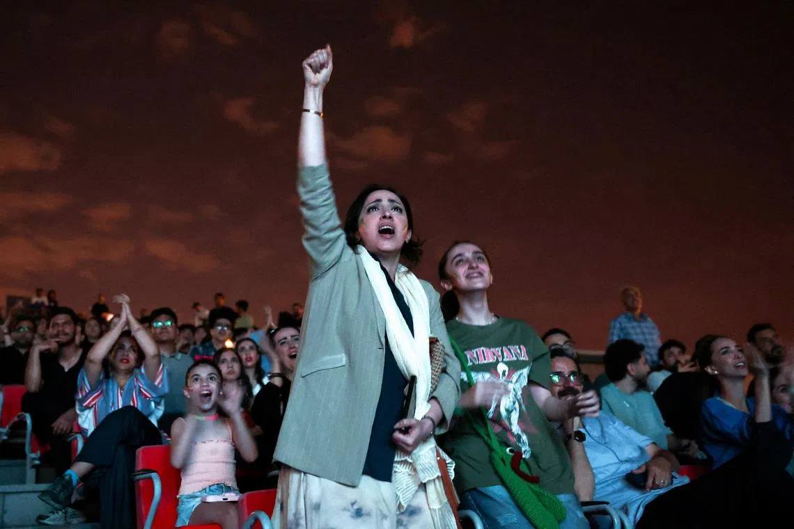 Soccer fans react as they watch the FIFA World Cup 2026 match between Belgium and Iran at a cinema in Tehran, Iran, June 21, 2026. Majid Asgaripour/WANA (West Asia News Agency) via REUTERS