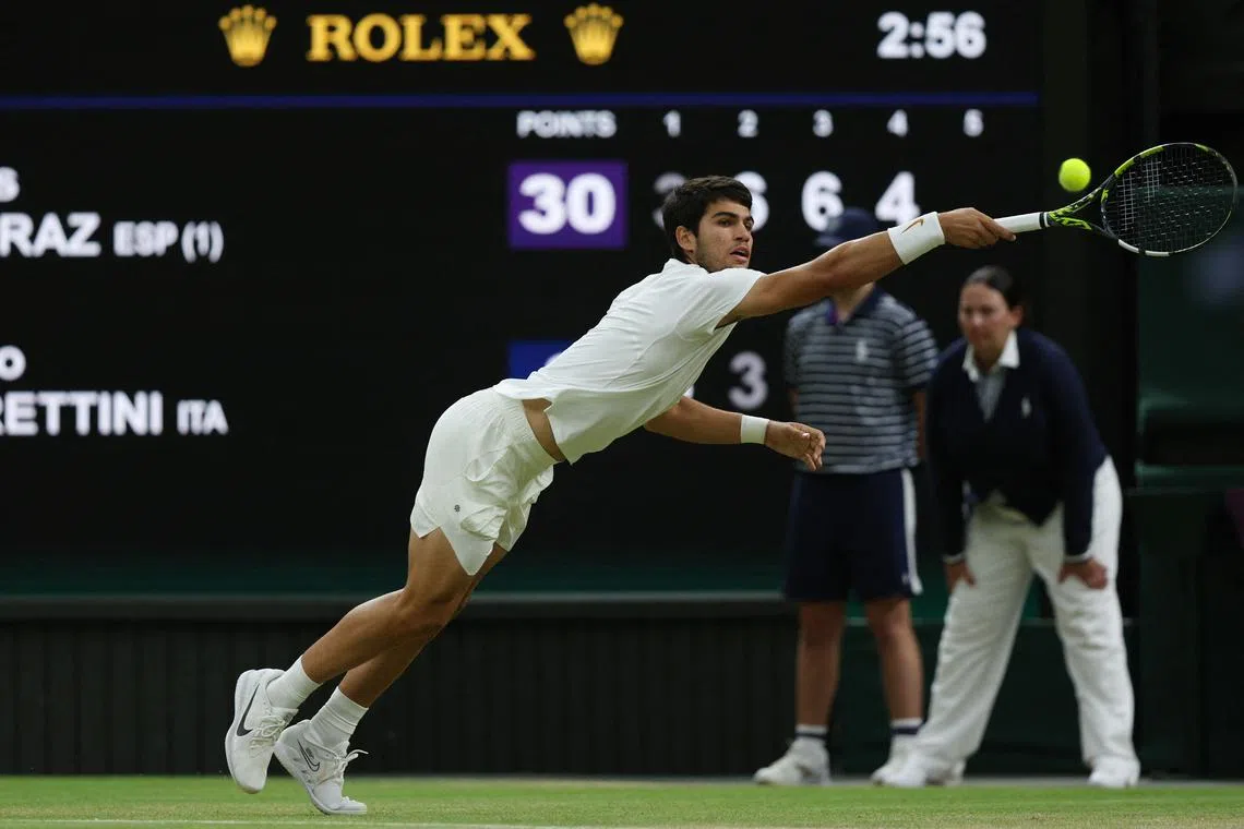 Spain's Carlos Alcaraz returns the ball to Italy's Matteo Berrettini during their men's singles tennis match.