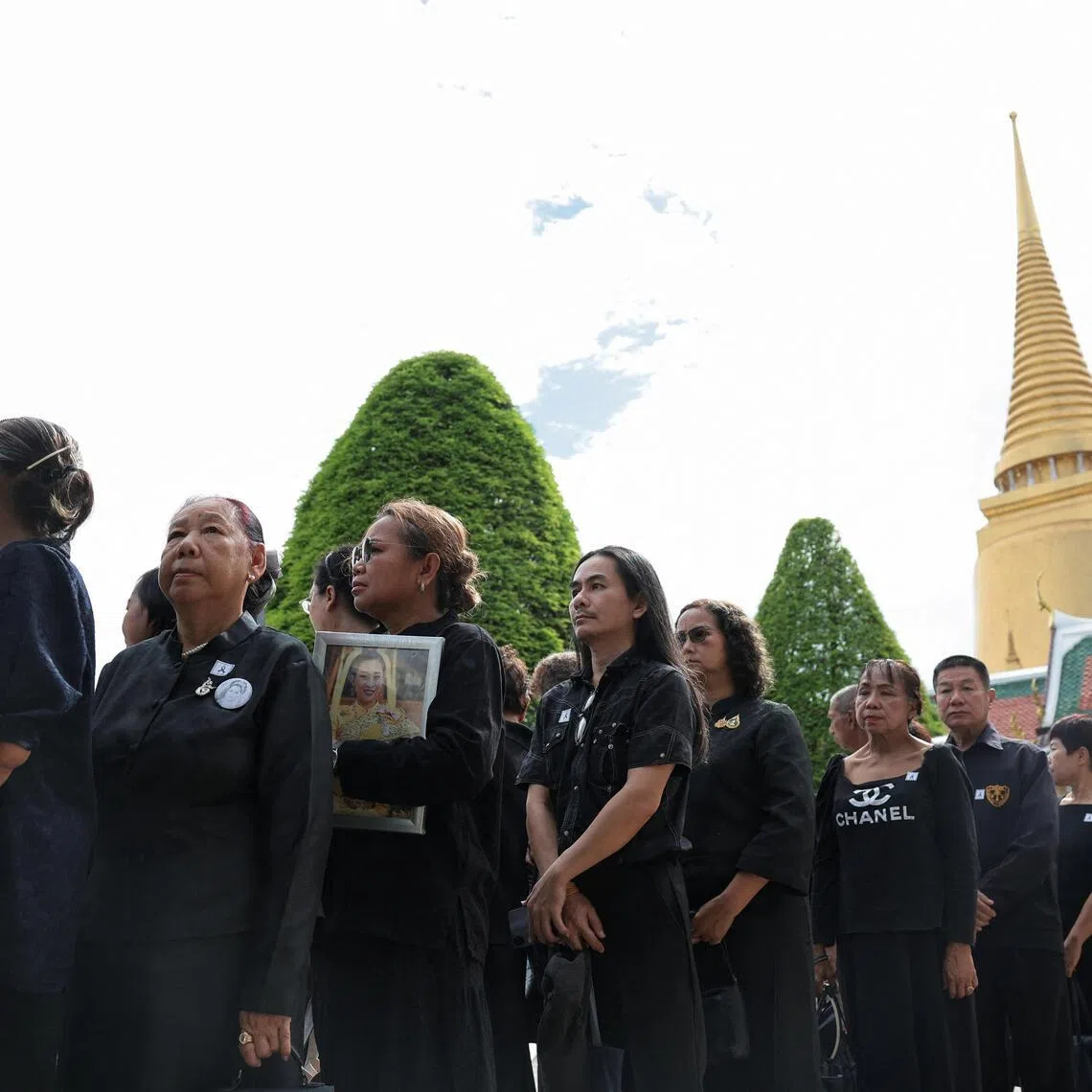 People queueing to pay their respects and offer ceremonial water ahead of the royal bathing ceremony for the late Princess Bajrakitiyabha at the Grand Palace in Bangkok on June 13. 