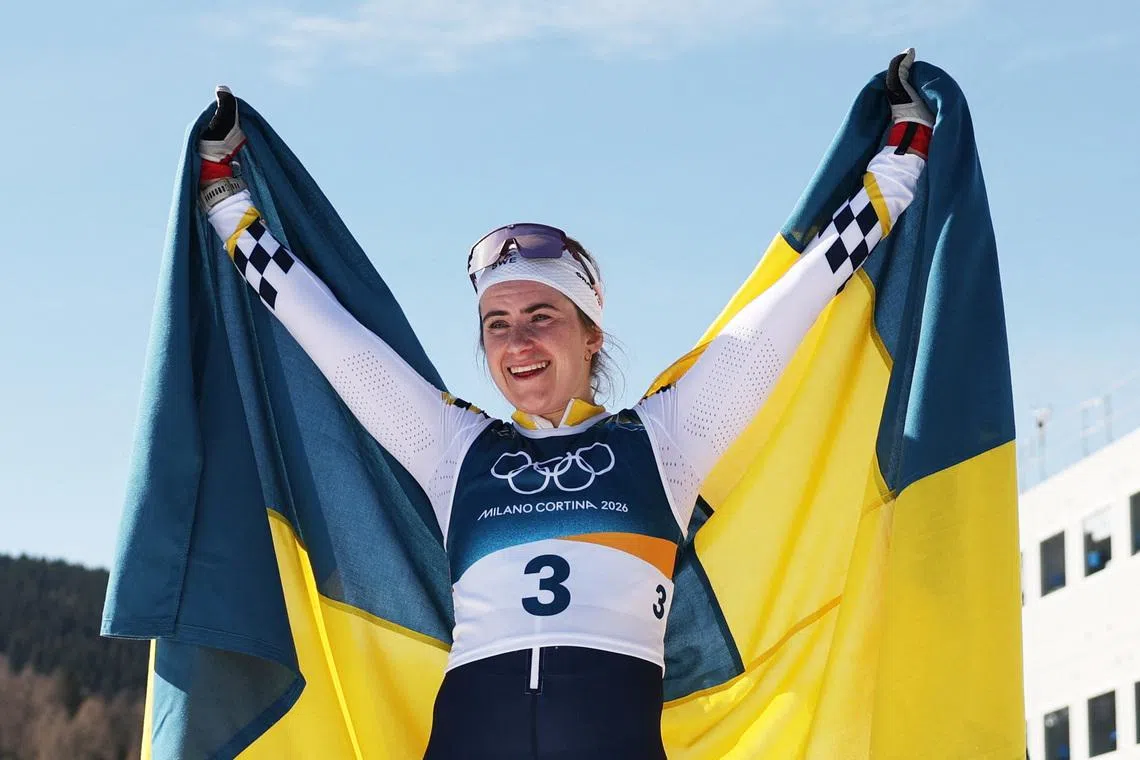 Milano Cortina 2026 Olympics - Cross-Country Skiing - Women's 50km Mass Start Classic - Tesero Cross-Country Skiing Stadium, Lago, Italy - February 22, 2026. Ebba Andersson of Sweden celebrates after crossing the finish line to win gold in the Women's 50km Mass Start Classic REUTERS/Kai Pfaffenbach
