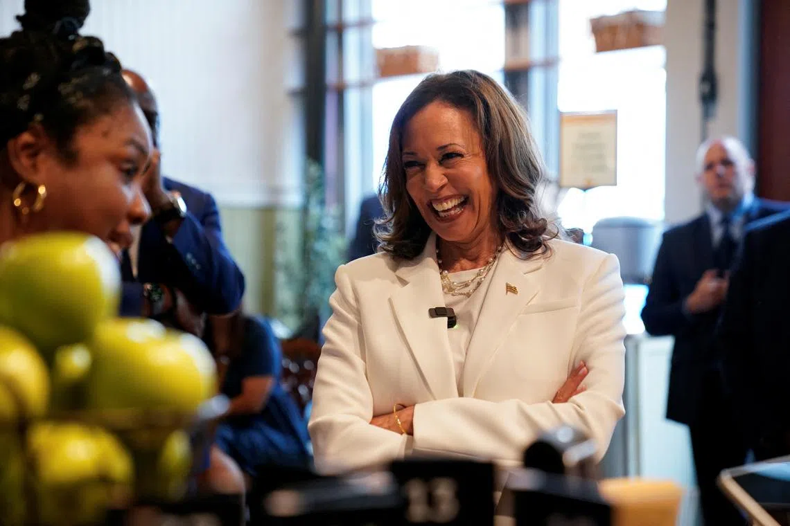 Democratic presidential nominee and U.S. Vice President Kamala Harris reacts as she visits Dottie's Market in Savannah, Georgia, U.S., August 29, 2024. REUTERS/Elizabeth Frantz