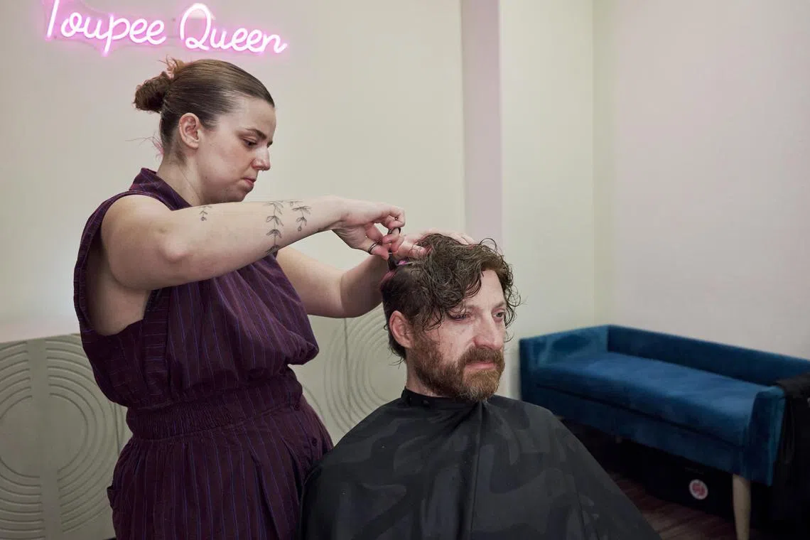 Ñ EMBARGO: NO ELECTRONIC DISTRIBUTION, WEB POSTING OR STREET SALES BEFORE 5:01 A.M. ET ON SUNDAY, JULY 20, 2025. NO EXCEPTIONS FOR ANY REASONS Ñ Emily Cheney works on a toupee for her new client, Luke Williams, at her studio in San Diego, Calif., July 11, 2025. Known as the Toupee Queen online, Cheney is helping change the way people talk about menÕs hair loss. (John Francis Peters/The New York Times)