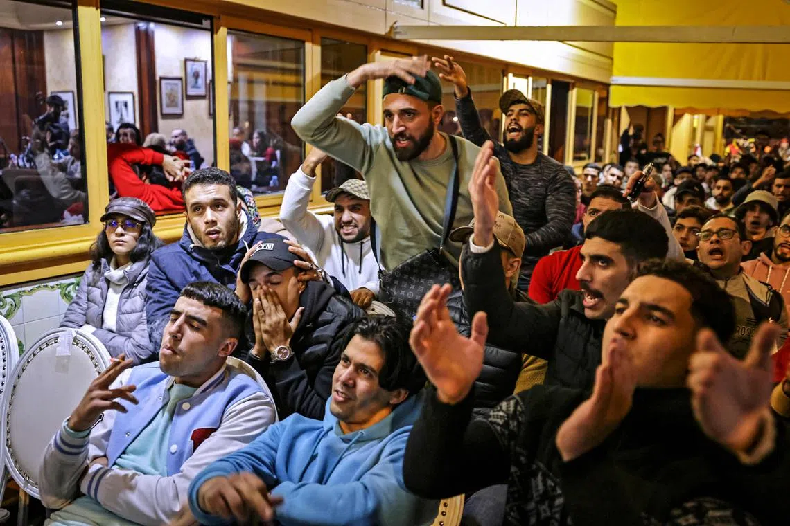 Morrocan fans react during the World Cup 2022 semi-final football match against France, in the capital Rabat on Dec 14.