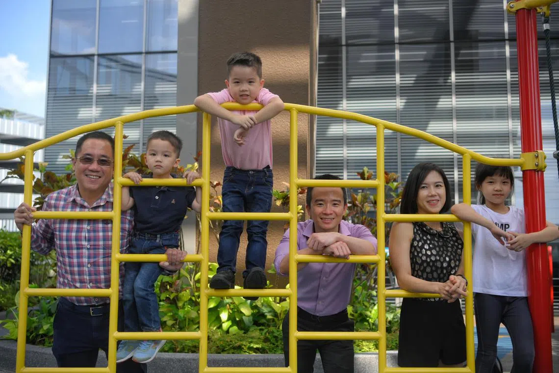 Emmanuel Pang (centre in pink), a six-year-old with situs inversus totalis, with his doctor Dr Chen Ching Kit (centre in purple), his parents Kenneth Pang, 47, and Bong Peei Nei, 42, his younger brother Sammuel, four and elder sister Jane, nine, pictured on June 19, 2023.