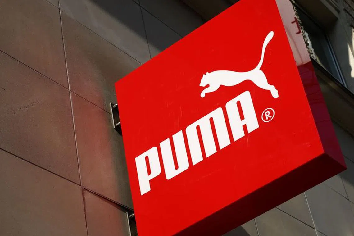 FILE PHOTO: The logo of German sports goods firm Puma is seen at the entrance of one of its stores in Vienna, Austria, March 18, 2016.   REUTERS/Leonhard Foeger/File Photo