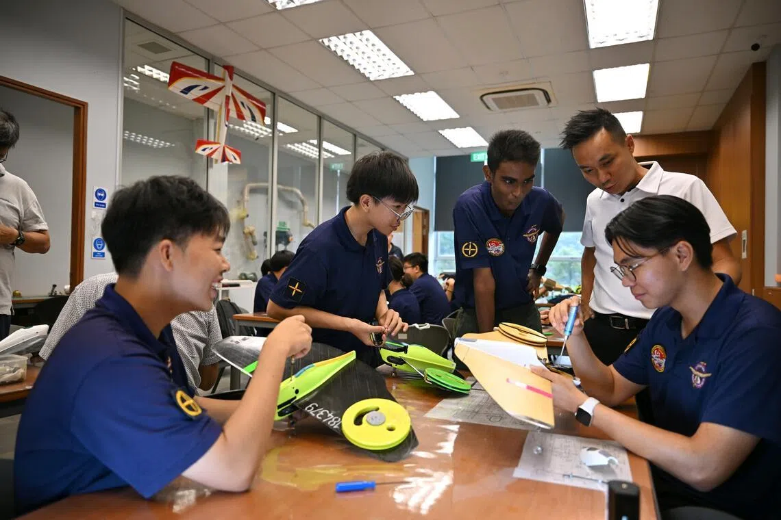 Singapore Youth Flying Club, 2026 FAI F2 World Championship for Control Line Model Aircraft, Singapore Junior Team 

(From left) Melvin Tan, 18, Ethan lok, 14, Moovendra Vickineswaran, 15,  Mr Kevin Su, and Daryl Chow, 19,  at Singapore Youth Flying Club on May 23, 2026.