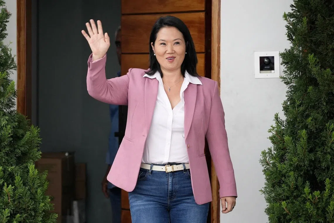 Conservative Keiko Fujimori waves to the media outside her home after she narrowly defeated leftist congressman Roberto Sanchez in the Peruvian presidential election, ahead of the official result announcement, in Lima, Peru, June 24, 2026. REUTERS/Angela Ponce