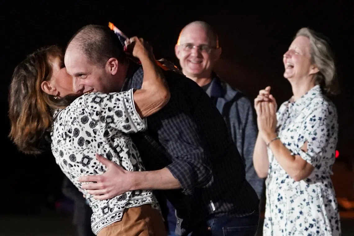 US journalist Evan Gershkovic, who was released from detention in Russia, is embraced by his mother Ella Milman, upon his arrival at Joint Base Andrews in Maryland, the United States, on Aug 1, 2024. 