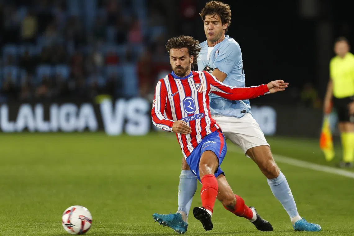 Atletico Madrid's Antoine Griezmann (left), in action here during his side's 1-0 La Liga win over Celta Vigo on Sept 26, scored the winner in the last Madrid derby in January. Atletico face Real Madrid on Sept 29 in a spicy La Liga derby clash.