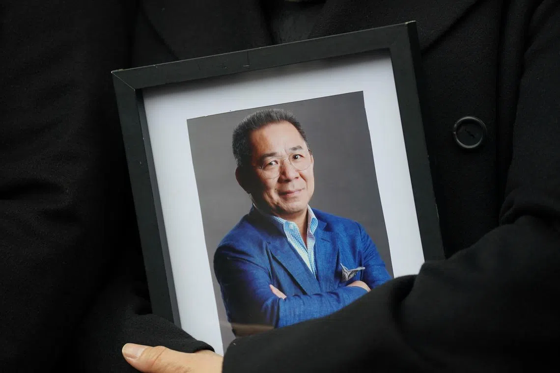 Aimon Srivaddhanaprabha holding a photo of her husband, Vichai Srivaddhanaprabha, outside Leicester's Coroner's Court, on Jan 28.