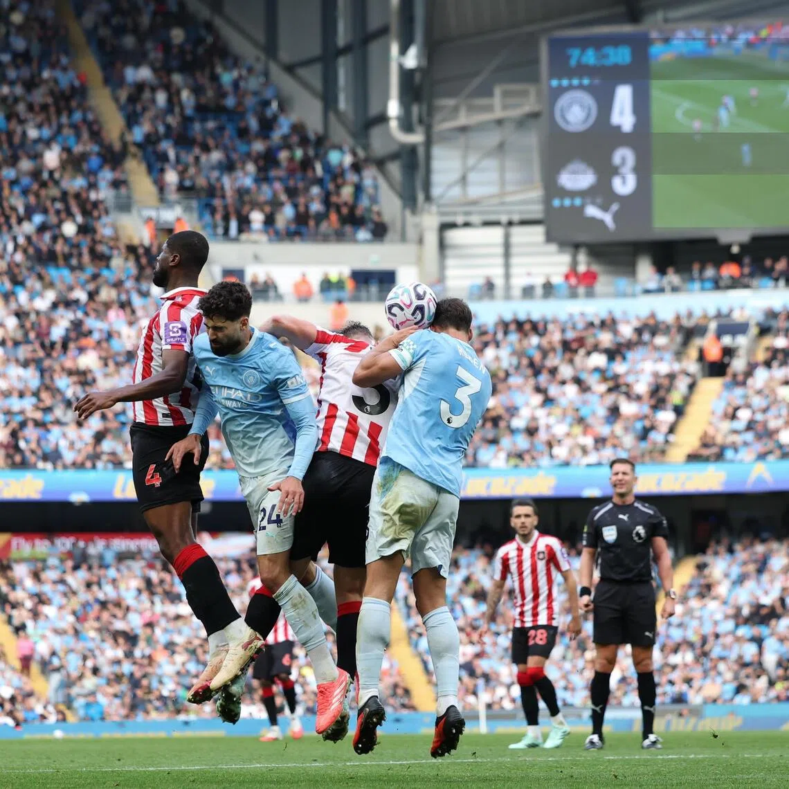 Manchester City (blue) in a 5-3 home win over Sunderland in their English Premier League match on Sept 20. They lead the standings with five straight wins this season but could face severe punishment for breaching financial rules, including points deduction and even relegation.