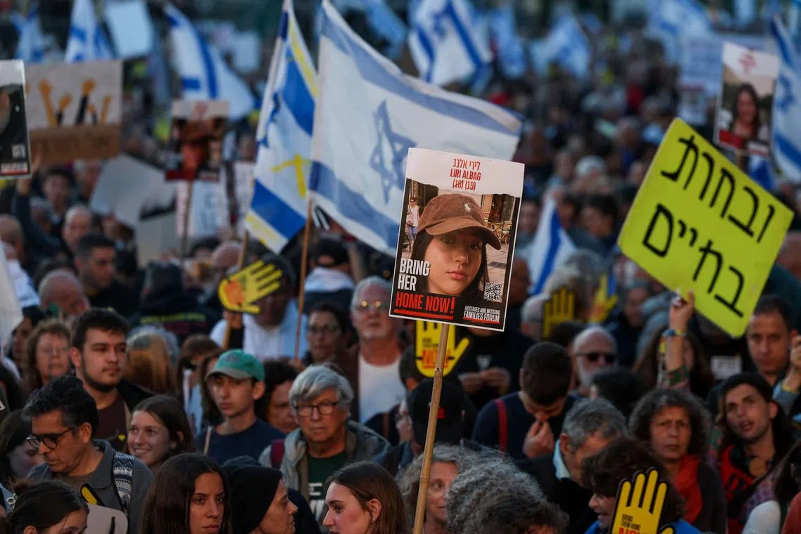 People rally outside Israel's parliament on April 7 for the immediate release of the hostages who were kidnapped by Hamas militants.