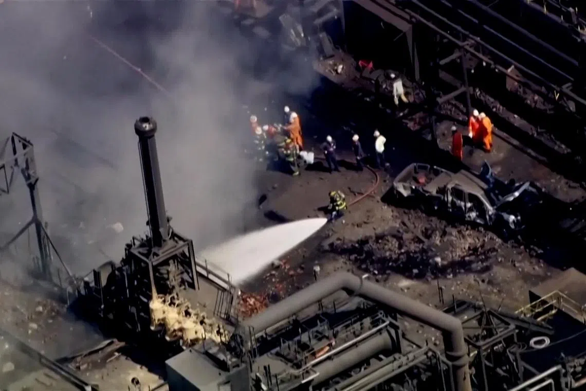 Firefighters spray water on the site of an explosion at U.S. Steel's Clairton Coke Works plant in Clairton, Pennsylvania, U.S. August 11, 2025 in this screengrab obtained from an aerial video.  ABC Affiliate WTAE via REUTERS