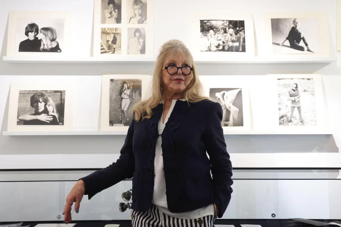 epa11219761 Former model Pattie Boyd poses with a collection of photography during a press call for The Collection of Pattie Boyd at Christie's Auction House in London, Britain, 14 March 2024. Boyd was the inspiration for songs by former husbands George Harrison's Something and Eric Clapton with Layla and Wonderful Tonight. The auction lots will be offered online by Christie's from 08 to 22 March 2024.  EPA-EFE/NEIL HALL