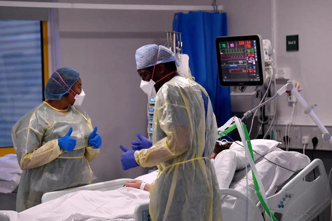 Nurses treat a Covid-19 patient in the ICU at Milton Keynes University Hospital in Britain in 2021.