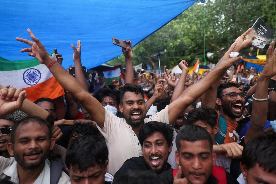 Cockroach Janta Party supporters celebrating in Jantar Mantar in New Delhi, after the resignation of Education Minister Dharmendra Pradhan on July 25.