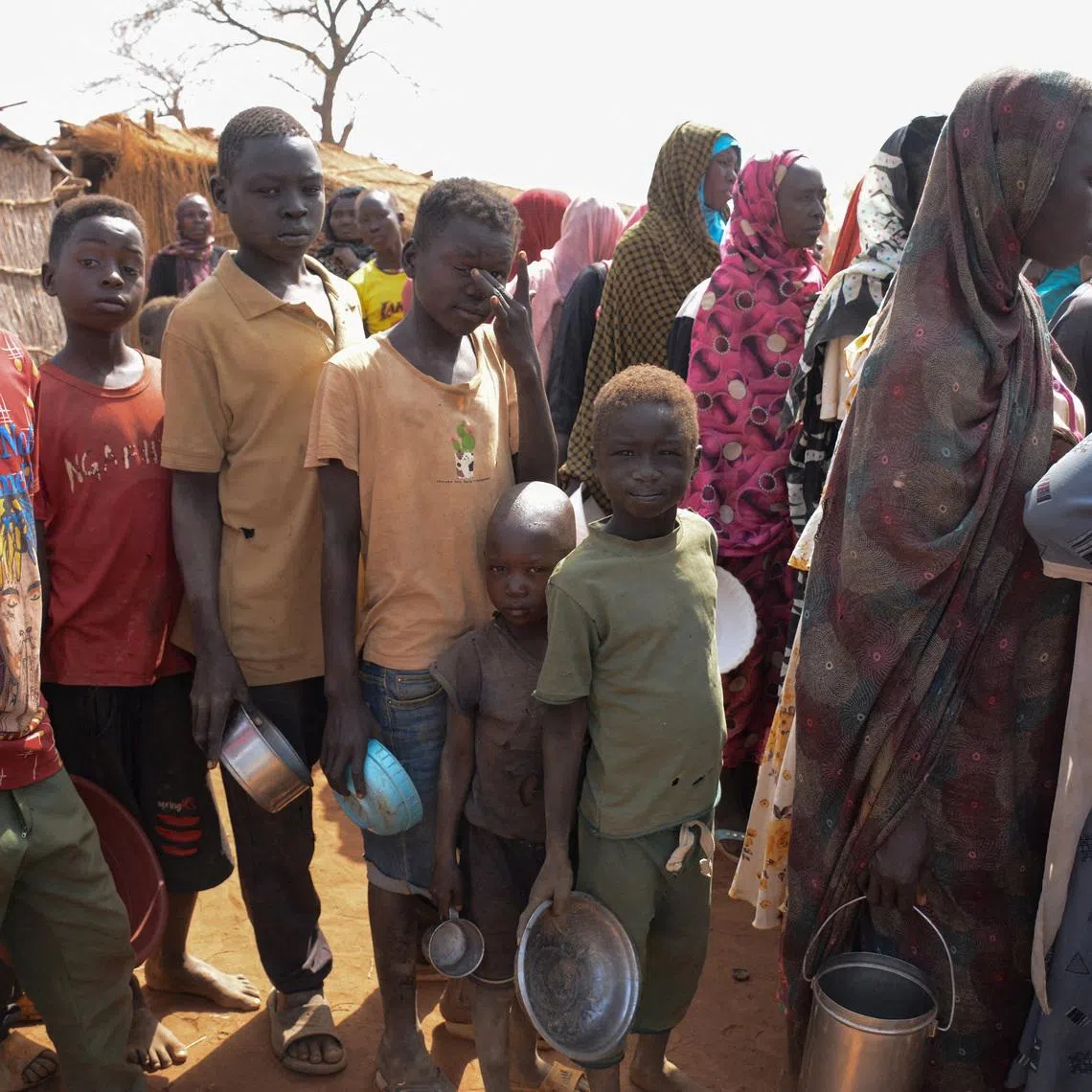 Newly arrived displaced people queue to receive meals at Thobo Camp, in Engpung County, Sudan, January 29, 2026. Karl Schembri/Norweigan Refugee Council/Handout via REUTERS