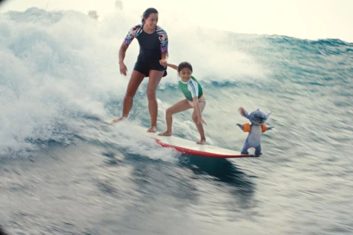 (From left) Sydney Agudong as Nani, Maia Kealoha as Lilo and Stitch in Disney’s live-action Lilo & Stitch.