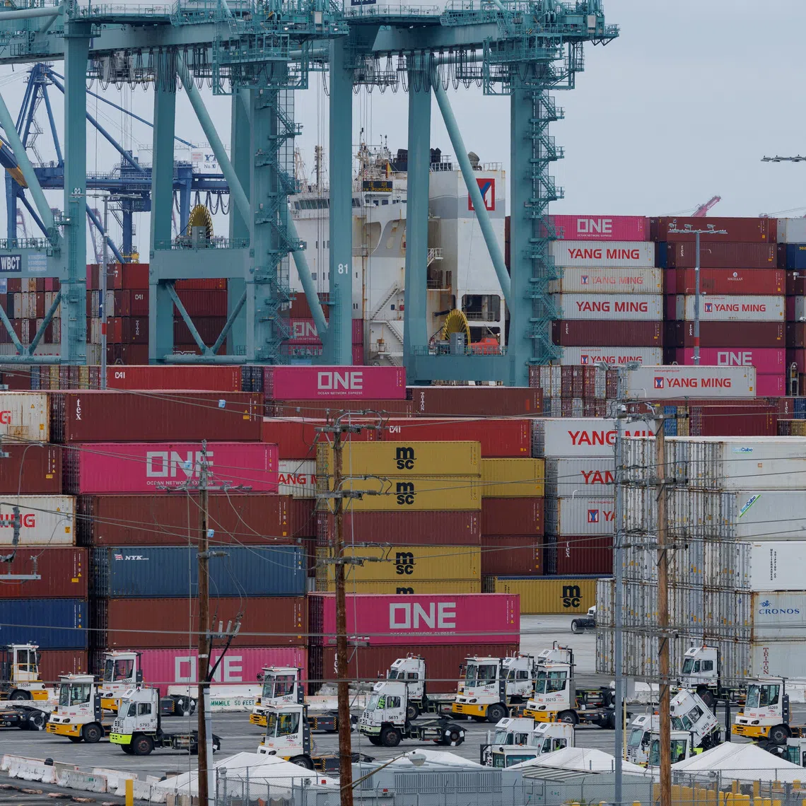 FILE PHOTO: A container ship is unloaded at the Port of Los Angeles, in San Pedro, California, U.S., May 1, 2025. REUTERS/Mike Blake/File Photo