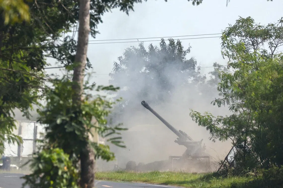 A Thai military mobile unit fires towards Cambodia's side after Thailand and Cambodia exchanged heavy artillery on Friday as their worst fighting in more than a decade stretched for a second day, in Surin, Thailand, July 25, 2025. REUTERS/Athit Perawongmetha