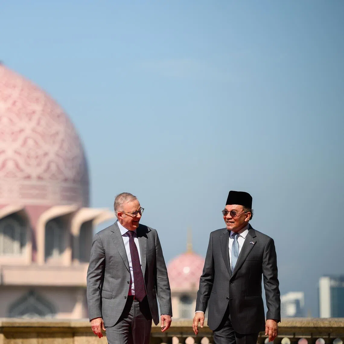 Australian Prime, Minister Anthony Albanese (L) and Malaysian Prime Minister Anwar Ibrahim in front of the Masjid Putra Mosque ahead of a bilateral meeting at Perdana Putra Complex in Kuala Lumpur, Malaysia on April 16.