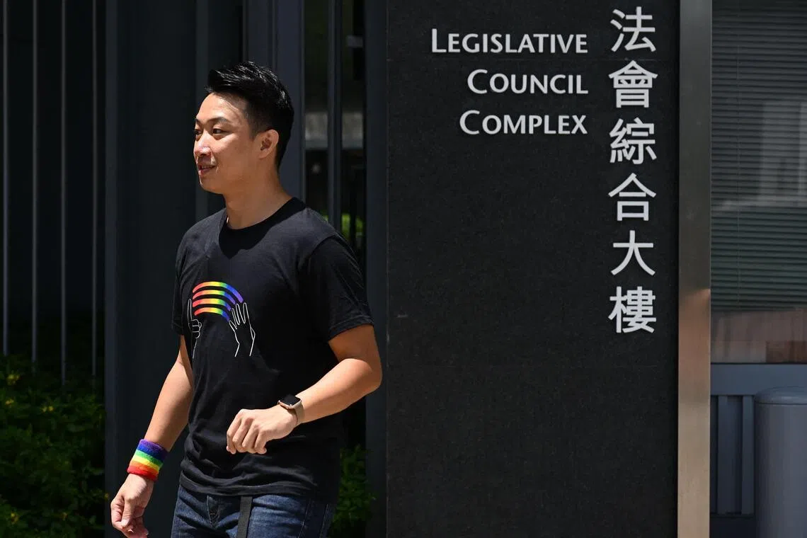 Hong Kong pro-democracy and LGBTQ rights activist Jimmy Sham arrives at the Legislative Council Complex in Hong Kong on September 10, 2025. Hong Kong lawmakers are expected to vote September 10 on whether to grant limited rights to same-sex couples, as fears grow in the LGBTQ community that even this narrow equality bid could be sunk by conservative pro-Beijing voices. (Photo by Peter PARKS / AFP)