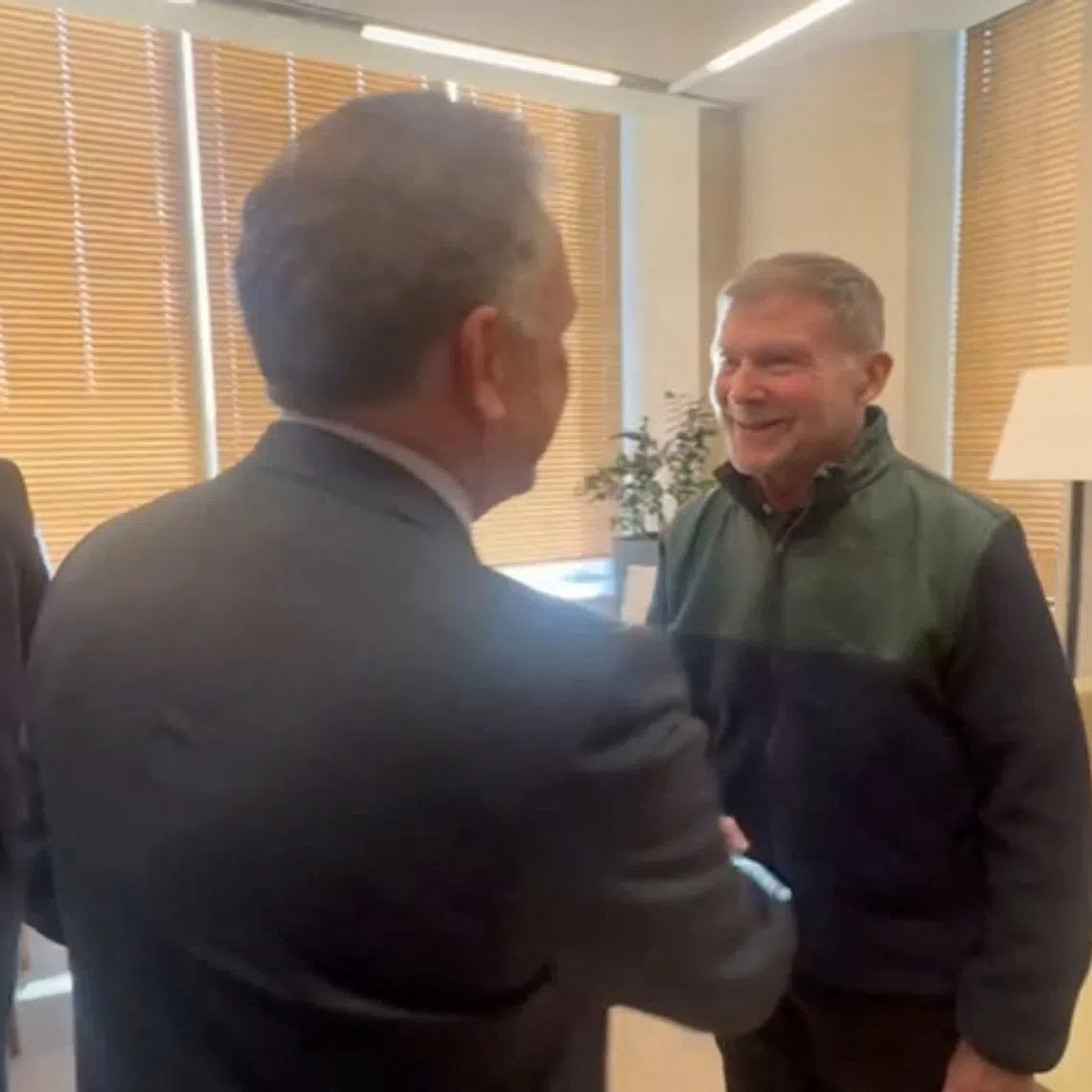 US special envoy Steve Witkoff and Russian presidential envoy Kirill Dmitriev attend a meeting with Stephen Hubbard, a 74-year-old retired U.S. schoolteacher who was recently freed after serving a prison sentence in Russia following his conviction on mercenary charges, in Saint Petersburg, Russia, October 21, 2026, in this still image taken from video. Obtained by Reuters/Handout via REUTERS
