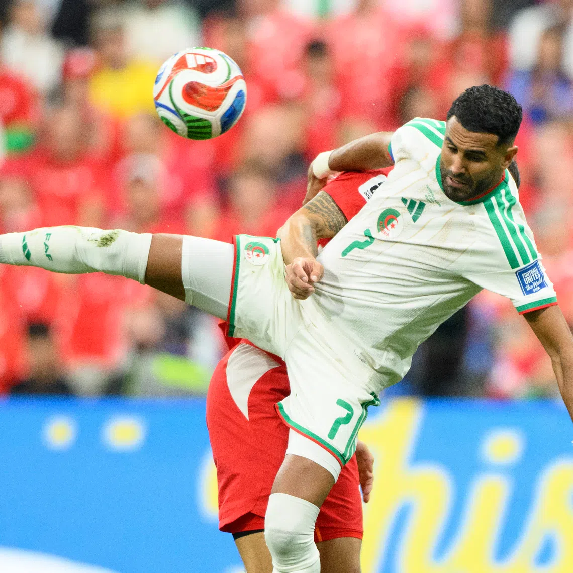 Jul 2, 2026; Vancouver, British Columbia, CAN; Algeria forward Riyad Mahrez (7) battles for the ball against Switzerland midfielder Ruben Vargas (17) during the first half during a Round of 32 match in the 2026 FIFA World Cup at BC Place Vancouver. Mandatory Credit: Anne-Marie Sorvin-Imagn Images