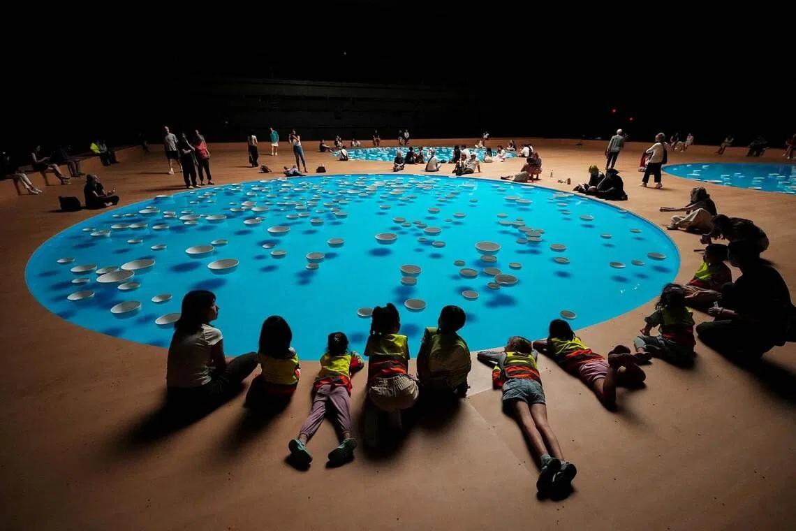 Schoolchildren observe the "clinamen" exhibit by French artist Celeste Boursier-Mougenot at Park Avenue Armory in New York City, U.S., July 9, 2026. REUTERS/Adam Gray TPX IMAGES OF THE DAY