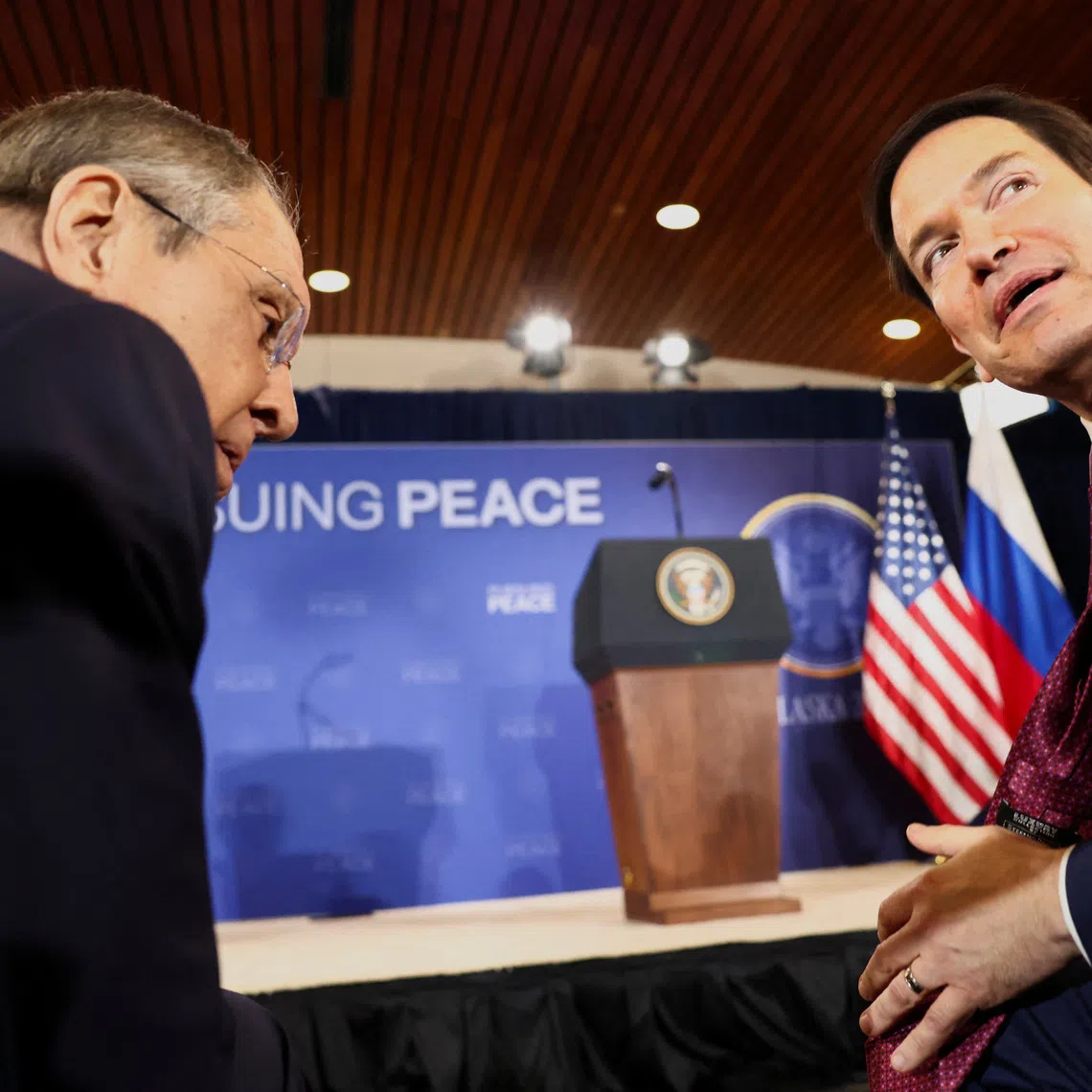 Russian Foreign Minister Sergei Lavrov and U.S. Secretary of State Marco Rubio talk as they attend a press conference held by U.S. President Donald Trump and Russian President Vladimir Putin following their meeting to negotiate an end to the war in Ukraine, at Joint Base Elmendorf-Richardson, in Anchorage, Alaska, U.S., August 15, 2025. REUTERS/Kevin Lamarque