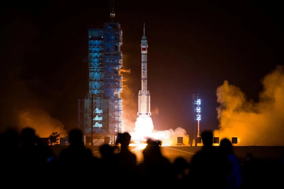 FILE PHOTO: A Long March-2F carrier rocket carrying the Shenzhou-18 spacecraft takes off from the Jiuquan Satellite Launch Center for a crewed mission to China's Tiangong space station, near Jiuquan, Gansu province, China April 25, 2024.  China Daily via REUTERS/File Photo