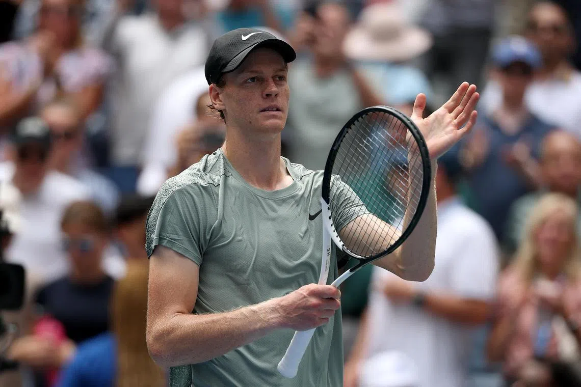Italy's Jannik Sinner celebrates his defeat of the US' Alex Michelsen.